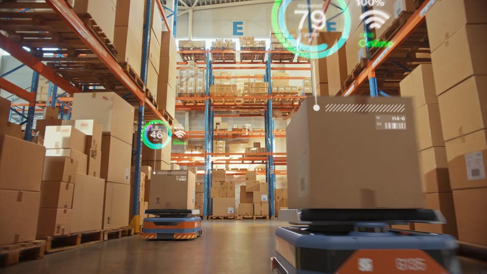 Automated transportation robots move boxes in a warehouse, one of many edge computing use cases in retail Automated transportation robots move boxes in a warehouse, one of many edge computing use cases in retail